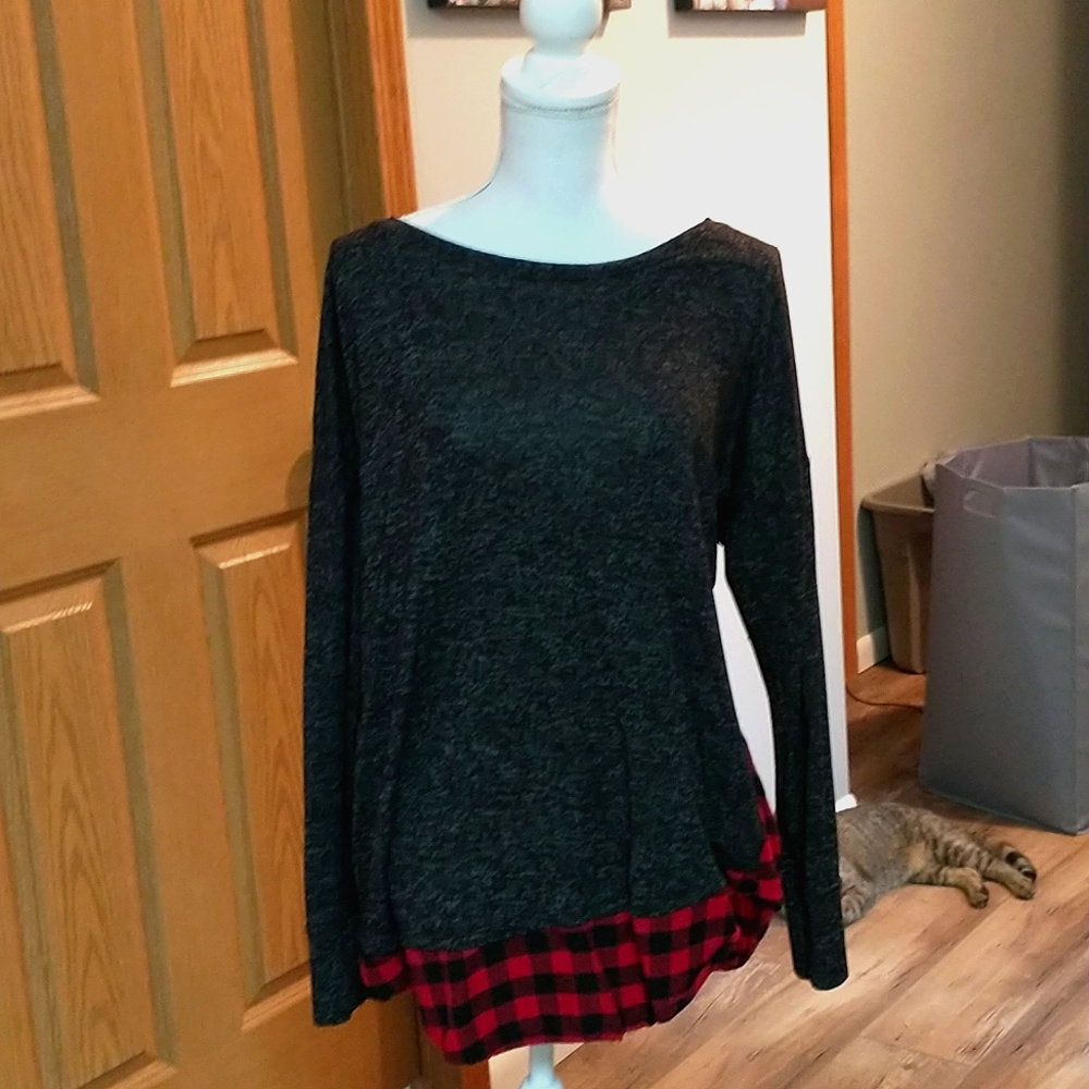 A tunic length black and plaid.